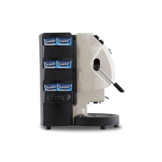 an espresso machine with a cup of coffee in front of it