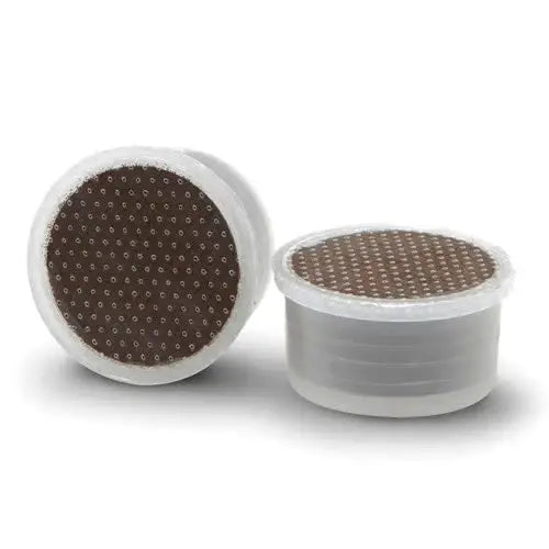 two Lavazza espresso point capsules with on it