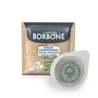 a box of borbone coffee pods next to a cup of coffee